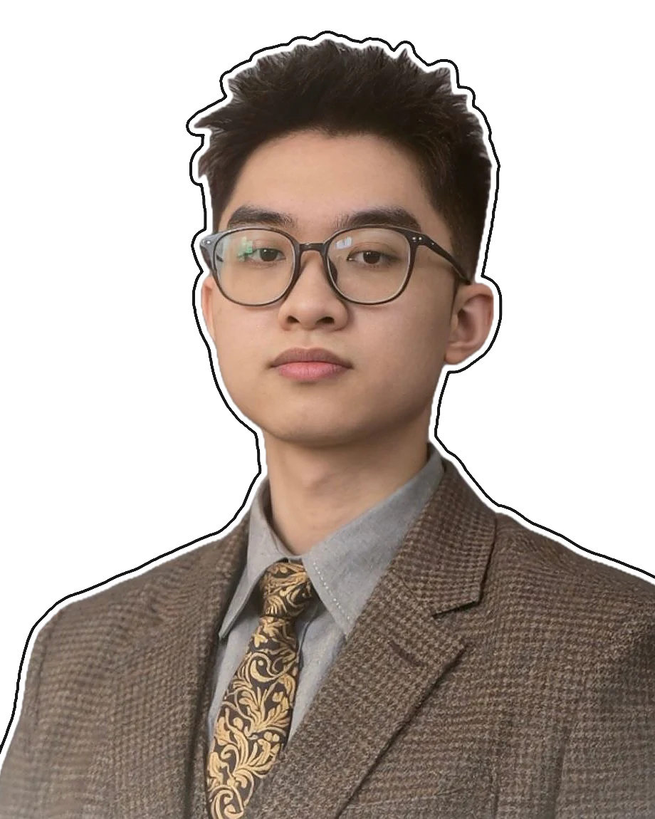 Hoàng Huy Đức in a brown tweed jacket, a grey shirt and a patterned gold tie, against a grey backdrop.